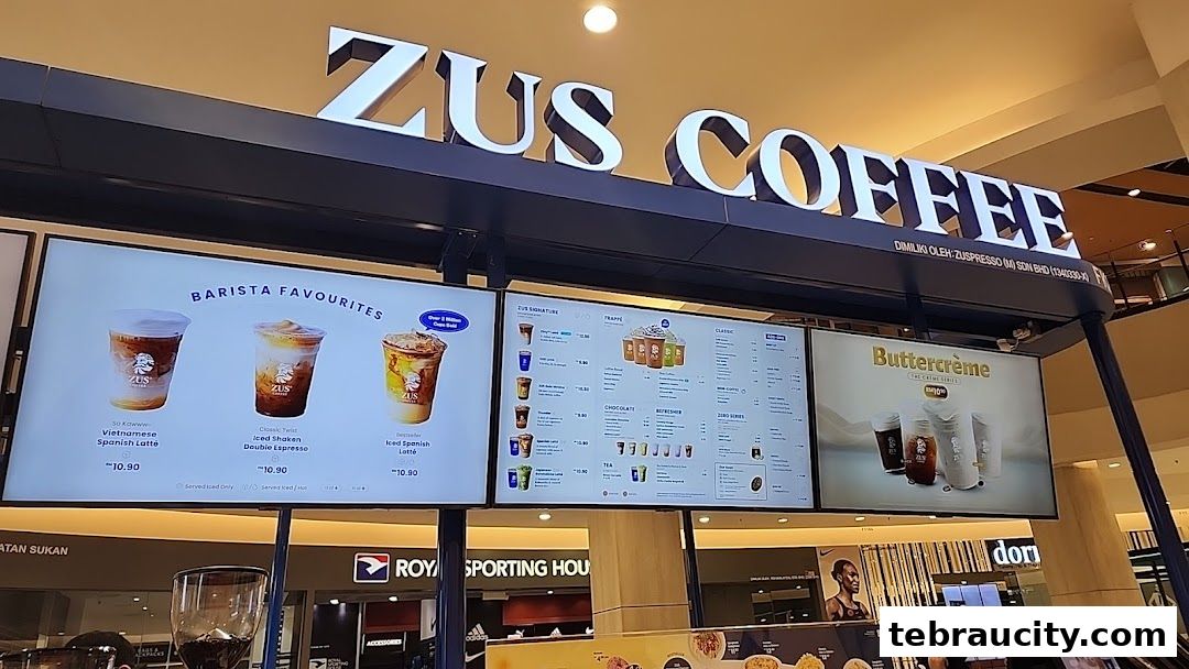 A digital menu board displaying various coffee drinks and their prices at ZUS Coffee.