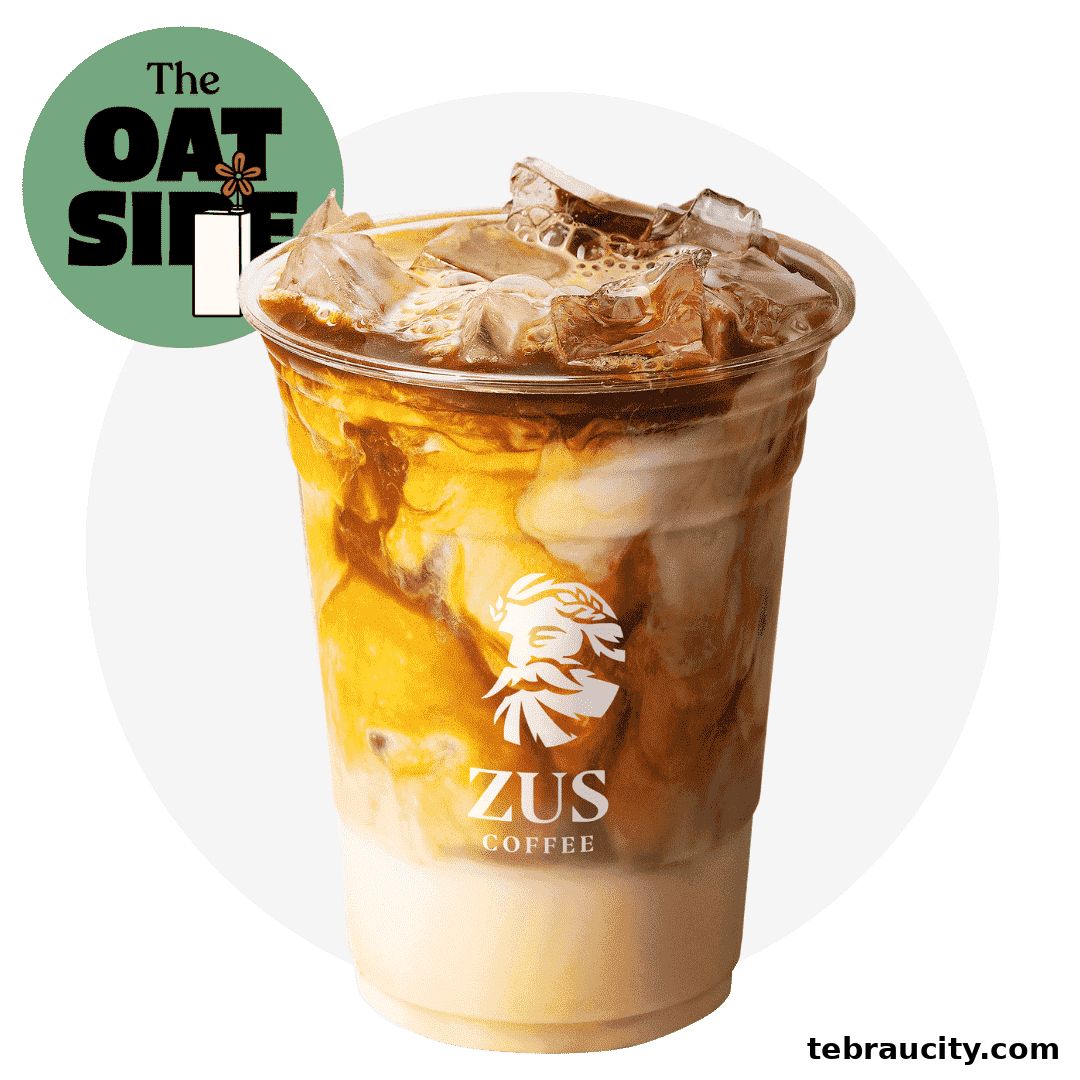 A refreshing iced coffee with layered milk and caramel, featuring the ZUS Coffee logo.