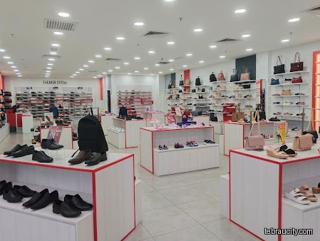 The image shows the interior of a Bata shoe store with displays.